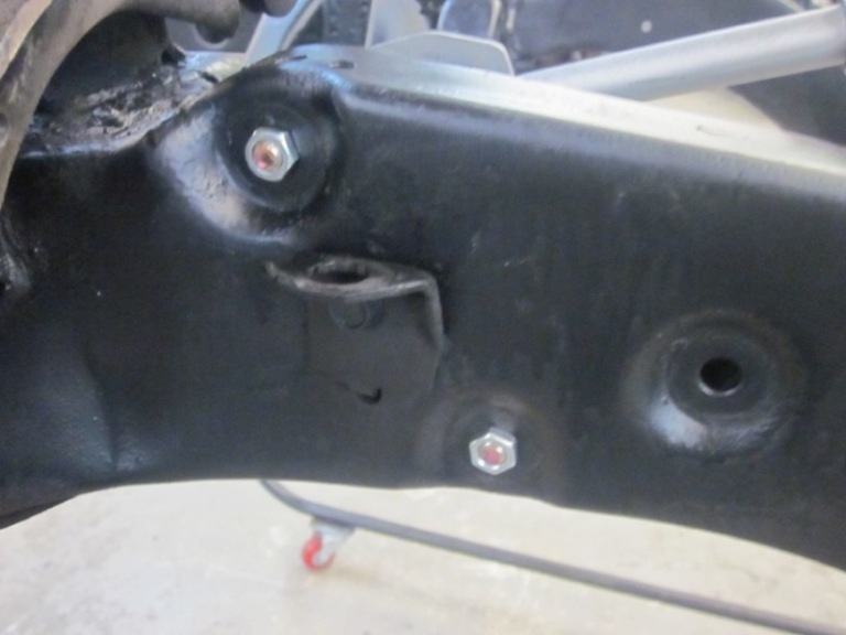 Assemble steering shaft as shown and secure bolts and slide thru new location holes. 